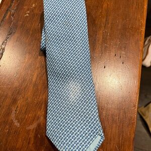 Limited edition blue Hermes tie with stain